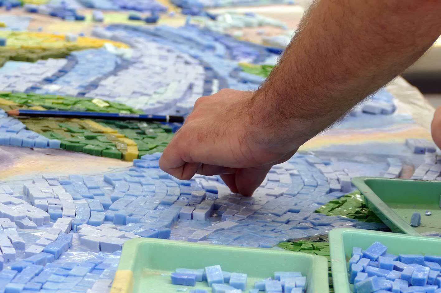 a mosaic artist making a custom mosaic